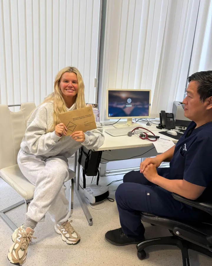 Kerry Katona holding her ColoAlert sample return envelope with Dr Chun Tang